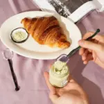 Wavey handled glass milk spoon
