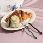 Wavey handled glass milk spoon